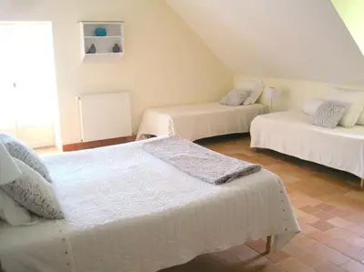 Un ou plusieurs lits dans un hébergement de l'établissement Grand gîte, campagne, piscine et spa - Saumur