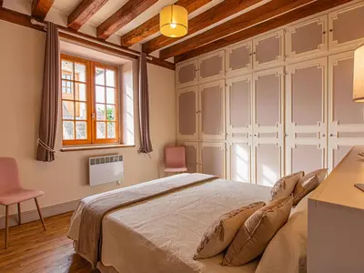 Un ou plusieurs lits dans un hébergement de l'établissement Gîte 4 chambres avec piscine couverte et jardin proche des châteaux de la Loire - FR-1-491-370