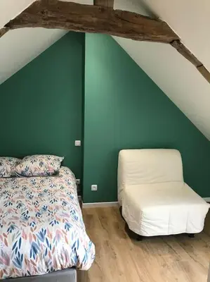 Un ou plusieurs lits dans un hébergement de l'établissement Maison en centre ville de Langeais