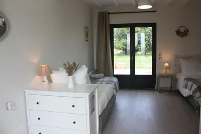 Un ou plusieurs lits dans un hébergement de l'établissement Les Chambres d'Emma