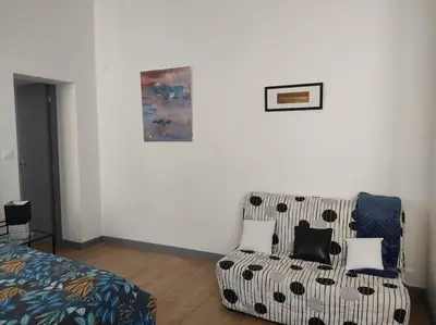 Un ou plusieurs lits dans un hébergement de l'établissement Appartement avec parking privé