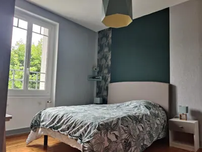 Un ou plusieurs lits dans un hébergement de l'établissement charmante chambre chez l'habitant