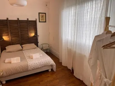 Un ou plusieurs lits dans un hébergement de l'établissement La chambre verte du gite de vendome
