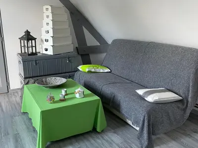 Coin salon dans l'établissement Chambre d'hôtes spacieuse et tranquille avec parking privé - FR-1-410-446