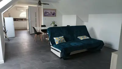 Coin salon dans l'établissement Appartement 8 pers neuf 80m2