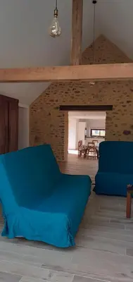 Coin salon dans l'établissement Maison avec mare