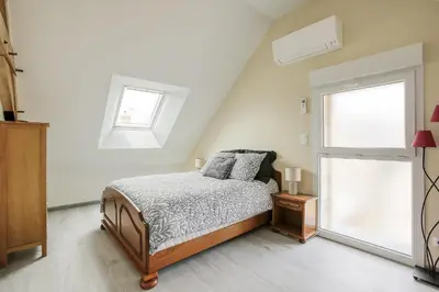 Un ou plusieurs lits dans un hébergement de l'établissement Maison de Marcelline - Pour 10p maison climatisée