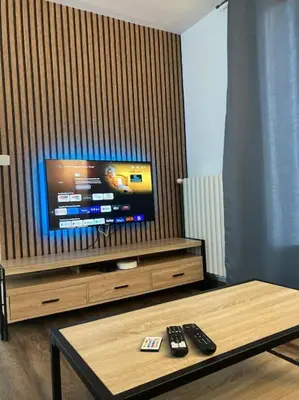 Télévision ou salle de divertissement dans l'établissement Gîte Coccinelle