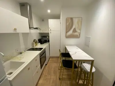 Cuisine ou kitchenette dans l'établissement Le Cadre Noir Lux Spa, Sauna, Jacuzzi