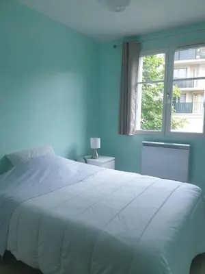 Un ou plusieurs lits dans un hébergement de l'établissement Location Blois