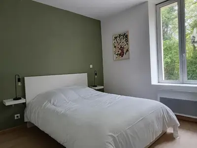 Un ou plusieurs lits dans un hébergement de l'établissement Gîte au coeur d'un vignoble