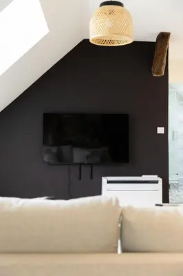 Télévision ou salle de divertissement dans l'établissement Logement quartier historique