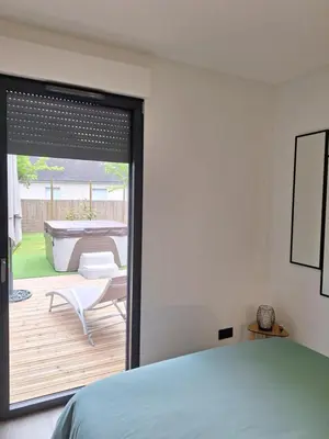 Un ou plusieurs lits dans un hébergement de l'établissement l'Escapade Montaise spa privé