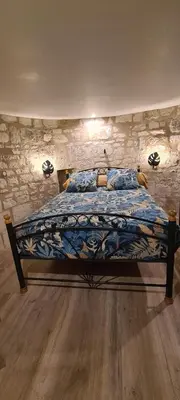 Un ou plusieurs lits dans un hébergement de l'établissement Moulin à vent romantique et atypique en Touraine