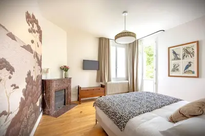 Un ou plusieurs lits dans un hébergement de l'établissement Gîte de la Futaie-Maison de caractère au calme