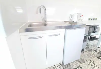 Cuisine ou kitchenette dans l'établissement Appartement, proche Gare et Centre-Ville