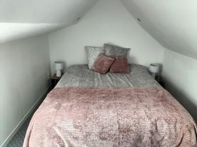 Un ou plusieurs lits dans un hébergement de l'établissement Maison reposante