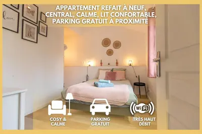 Un ou plusieurs lits dans un hébergement de l'établissement Confort Modernité Centre Ville Parking Gratuit