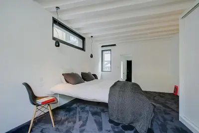 Un ou plusieurs lits dans un hébergement de l'établissement Logement atypique 200m2 au Calme et Confort