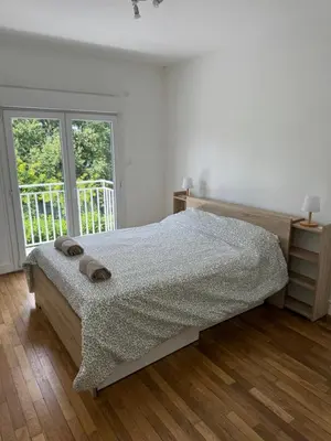 Un ou plusieurs lits dans un hébergement de l'établissement Appartement proche de Tours