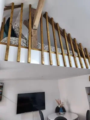 Télévision ou salle de divertissement dans l'établissement La maison du lavoir