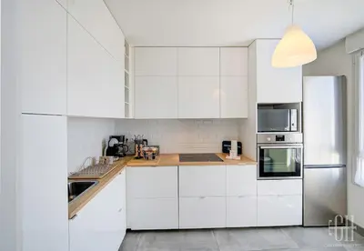 Cuisine ou kitchenette dans l'établissement Le Lilas - 2 chambres - parking