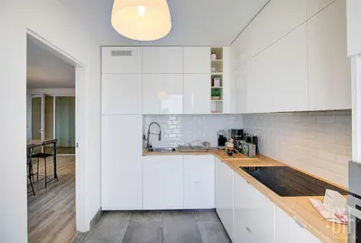 Cuisine ou kitchenette dans l'établissement Le Lilas - 2 chambres - parking