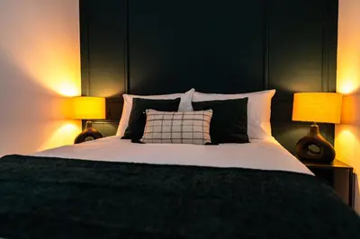 Un ou plusieurs lits dans un hébergement de l'établissement L'Élégant, appartement au cœur de la ville