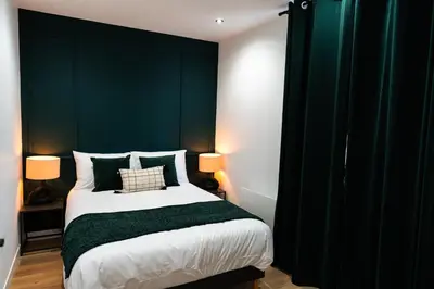 Un ou plusieurs lits dans un hébergement de l'établissement L'Élégant, appartement au cœur de la ville