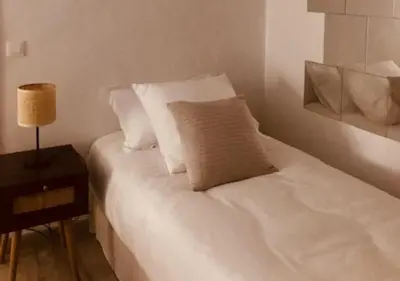 Un ou plusieurs lits dans un hébergement de l'établissement LE JARDIN DE LA PICHONNERIE Chambres d'hôtes