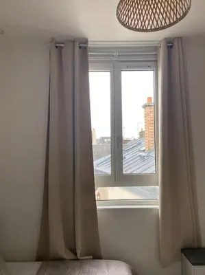 Un ou plusieurs lits dans un hébergement de l'établissement Le Bohème studio central