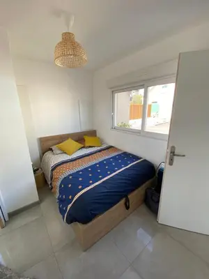 Un ou plusieurs lits dans un hébergement de l'établissement gîte cosy Le Mans