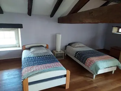 Un ou plusieurs lits dans un hébergement de l'établissement Maison Les Giraudeaux à 35 minutes du Futuroscope