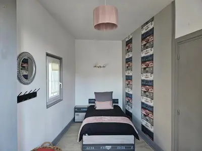 Un ou plusieurs lits dans un hébergement de l'établissement Regard sur le château