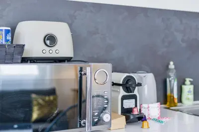Cuisine ou kitchenette dans l'établissement Le Cocon Des Prébendes - Hypercentre - Netflix