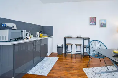 Cuisine ou kitchenette dans l'établissement Le Cocon Des Prébendes - Hypercentre - Netflix