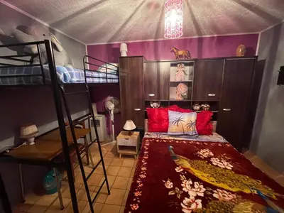 Un ou plusieurs lits dans un hébergement de l'établissement Chambre d'hôtes Lamidome