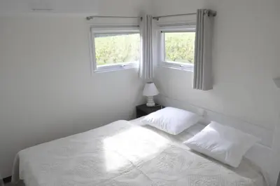 Un ou plusieurs lits dans un hébergement de l'établissement Les Cottages des Pierres d'Aurèle