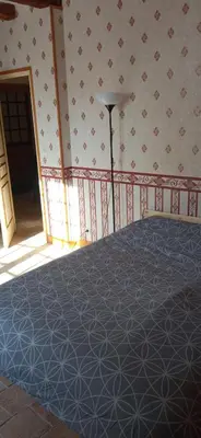 Un ou plusieurs lits dans un hébergement de l'établissement La maison paisible au village
