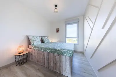 Un ou plusieurs lits dans un hébergement de l'établissement Le Logis Madeleine - Maison Cosy