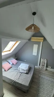 Un ou plusieurs lits dans un hébergement de l'établissement Charmante maison près des bords de la Loire