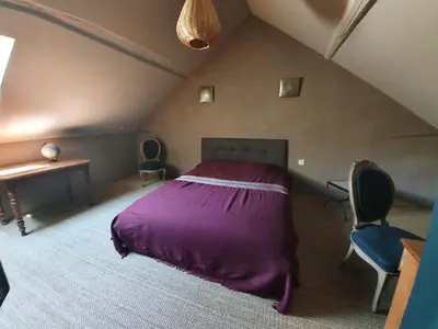 Un ou plusieurs lits dans un hébergement de l'établissement Maison de charme