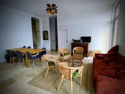 Coin salon dans l'établissement Magnifiques Ecuries juste rénovées - Domaine de la Mulotière