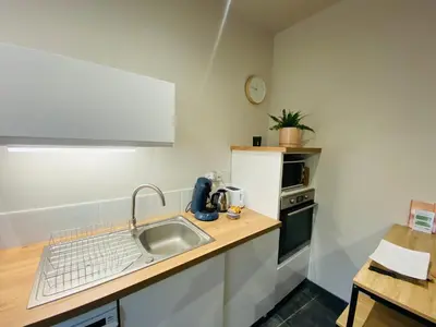 Cuisine ou kitchenette dans l'établissement Le Petit Francillon