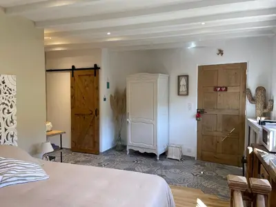Un ou plusieurs lits dans un hébergement de l'établissement Le Petit Nid du Vieux Logis Ravissante Suite dans vallée troglodyte