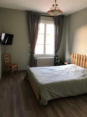 Un ou plusieurs lits dans un hébergement de l'établissement Domaine de Praline Arthur
