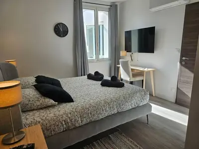 Un ou plusieurs lits dans un hébergement de l'établissement Belle Maison Loft patio jacuzzi clim Tours