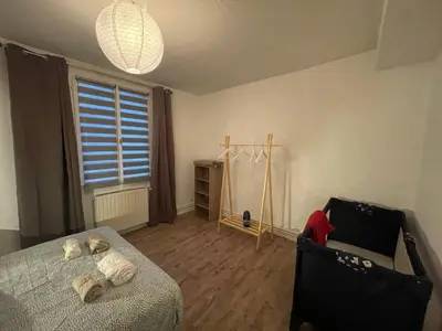 Un ou plusieurs lits dans un hébergement de l'établissement Jolie Maison de Ville