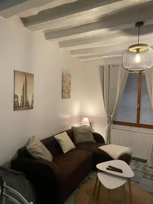 Coin salon dans l'établissement Jolie Maison de Ville