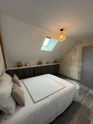 Un ou plusieurs lits dans un hébergement de l'établissement Charmante maison de bourg cosy accès wifi